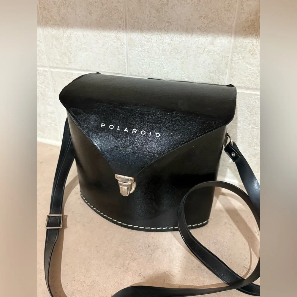 Vintage Polaroid Swinger camera and case